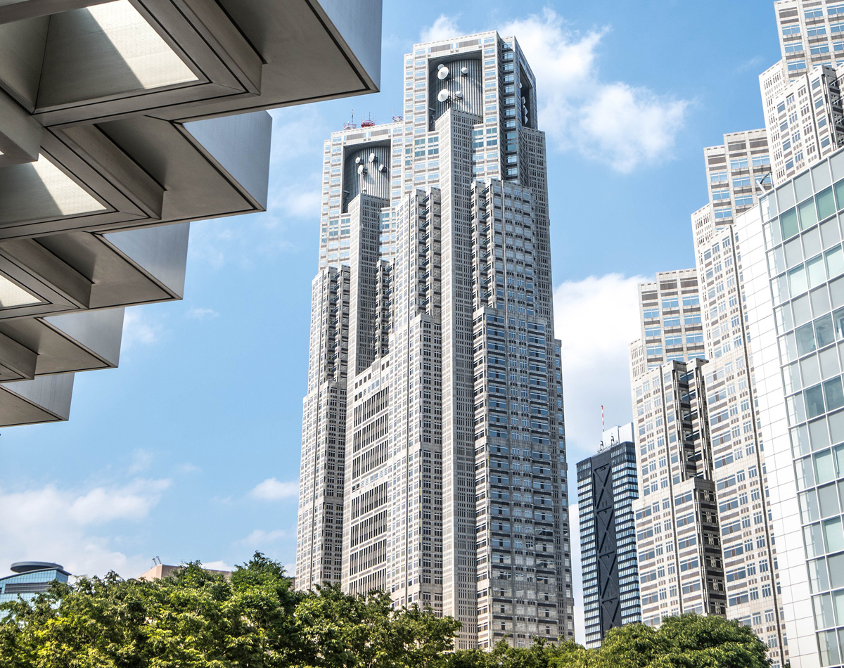 Tokyo Metropolitan Government Building towers against a blue sky